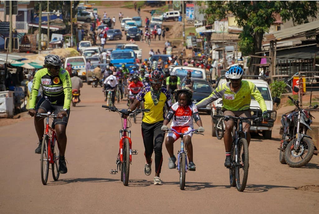 Cyclists riding through Nairobi streets