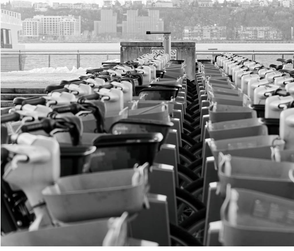 Rows of bikes docked at a VELO bike-sharing station